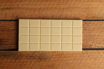 white chocolate tablet in color background