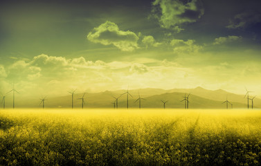Panoramic view of sunny landscape with eco power, wind turbines, moody toned