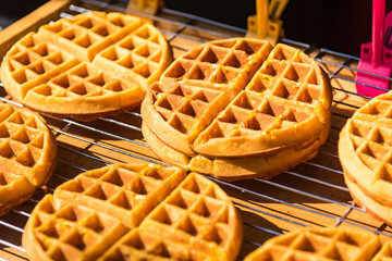 Tasty sweet waffles in street food.