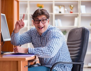 Young student at computer table