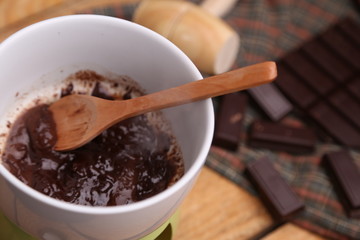 melting chocolate tablet in color background