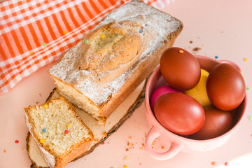 red Easter eggs in a plate and a cupcake, towel, Easter treat