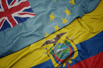 waving colorful flag of ecuador and national flag of Tuvalu .