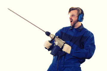 Crazy construction worker with a puncher on a white background
