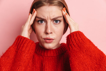Serious young woman posing isolated
