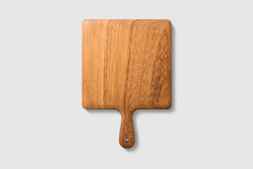 Mockup of wooden cutting board isolated on light grey background, high resolution.