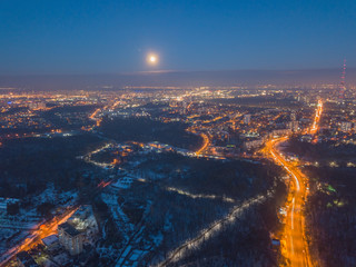 Aerial drone view. Full moon at dusk over a residential area of Kiev.