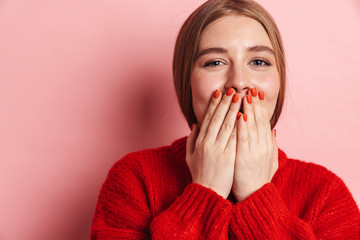 Cute woman posing isolated over pink wall