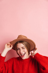 Positive young cute woman posing isolated