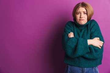 Frozen young woman posing isolated