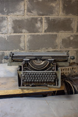 Fototapeta na wymiar Old, antique typewriter close-up in the dust.