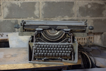 Fototapeta na wymiar Old, antique typewriter close-up in the dust.