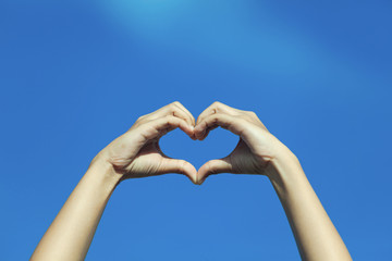 Hand heart symbol to show their love for each other.
