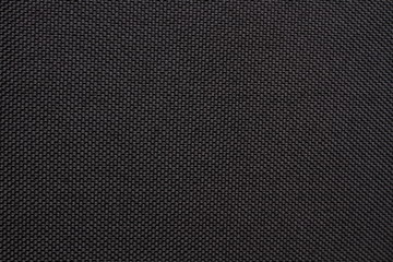 Obraz premium Black dense fabric, background. Close-up.