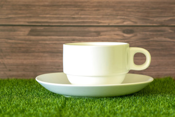 Coffee cup on the artificial grass