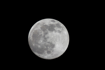 Full moon through a telescope on a dark night