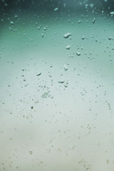 Rain drops fall on window. Wet rainy weather.  Water drops strike