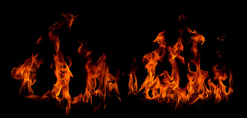 Fototapeta na wymiar On fire flames at the black background