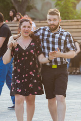 Kizomba, bachata or salsa concept - couple dancing social dance on open air party.