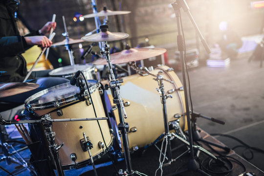 Drumset in close up view on stage, drummer playing set on stage