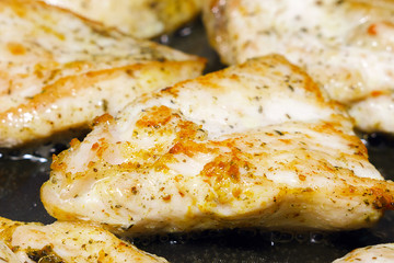 fried chicken fillet in a pan. Roasted chicken breasts cooking
