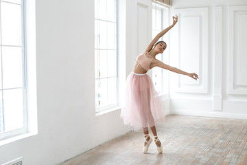 horizontal photo of a dancing ballerina