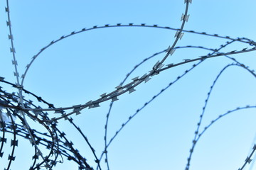 Barbed wire on the fence of a prison or closed area