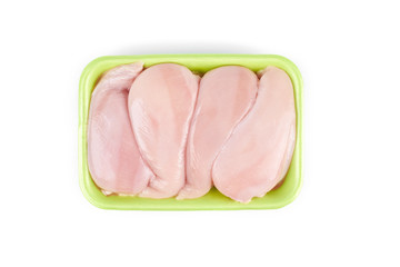 Raw chicken fillet in a green tray ,isolated on white background