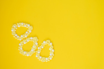 Easter meringue decor. Egg shape on yellow backgrounds.