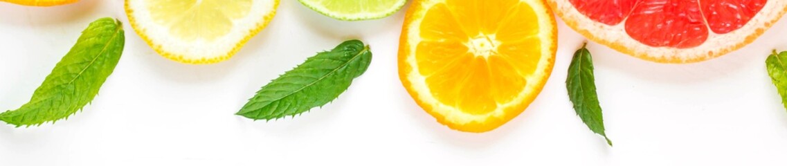 banner of citrus food pattern on white background - assorted citrus fruits with mint leaves. Isolated on white background