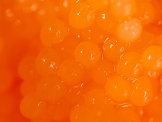 Red caviar in a shrimp as a background