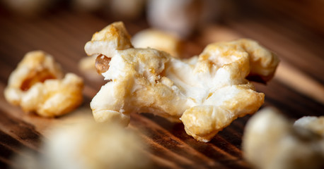 Popcorn flakes on a wooden background