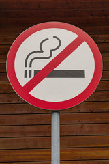 No smoking sign, with wooden wall background