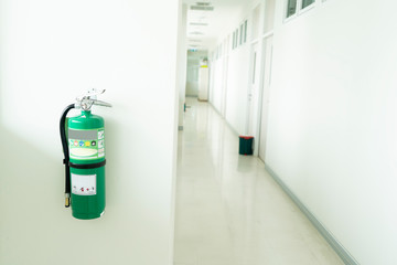 Fire extinguisher install front of the room.Security system concept.