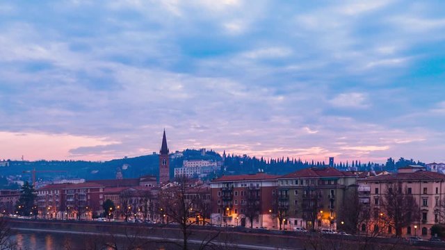 Timelapse of Verona small Italian city town in Italy with view of historical house building bridge people on street with panoramic cityscape traffic and sunset for holiday vacation in winter summer 
