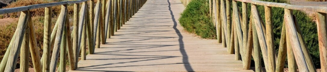 Wooden walkway panoramic view. Concept for summer holidays, journey, travel, etc.