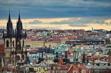 Fototapeta na wymiar Beautiful view from the park at Prague streets, old historical buildings and rooftops