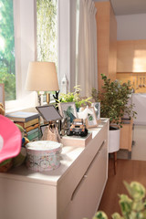 a sideboard near by the window