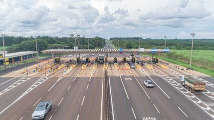 Aerial image highway toll plaza and speed limit, view of automatic paying lanes, non-stop.
