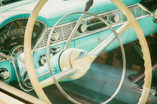 Retro styled image of the interior of a classic blue Cadillac fifties car in Den Bosch, The Netherlands on May 12, 2019