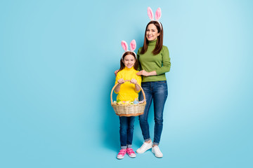 Full length body size view of nice attractive lovely cheerful cheery girls carrying festive...