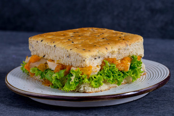 chicken sandwich with cheese and vegetables