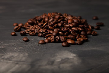 Composition with a coffee beans on a textured plastered background with a variety of arbitrary stains