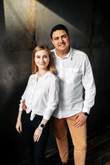 Portrait of a young attractive guy with a girl