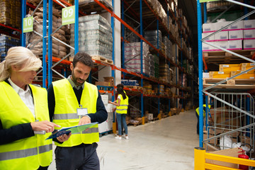Fototapeta na wymiar Managers in Warehouse discuss about business strategy 