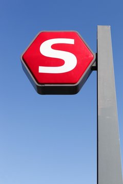 Copenhagen, Denmark - April 2, 2019: The Copenhagen S-train sign on a pole. The S-train of Copenhagen in Denmark is a hybrid urban-suburban rail serving the the Copenhagen urban area
