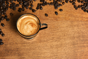 Cup of coffee with coffee beans