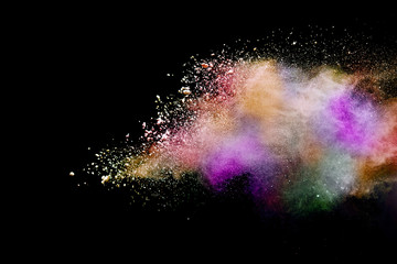 Abstract powder splatted background. Colorful powder explosion on black background. Colored cloud. Colorful dust explode. Paint Holi.