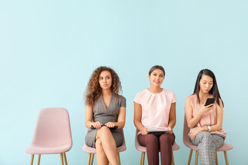 Fototapeta premium Young women waiting for job interview indoors