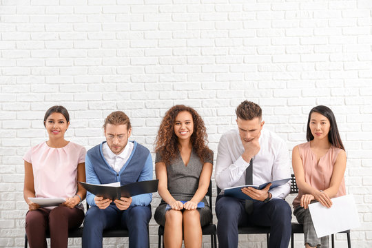 Young people waiting for job interview indoors